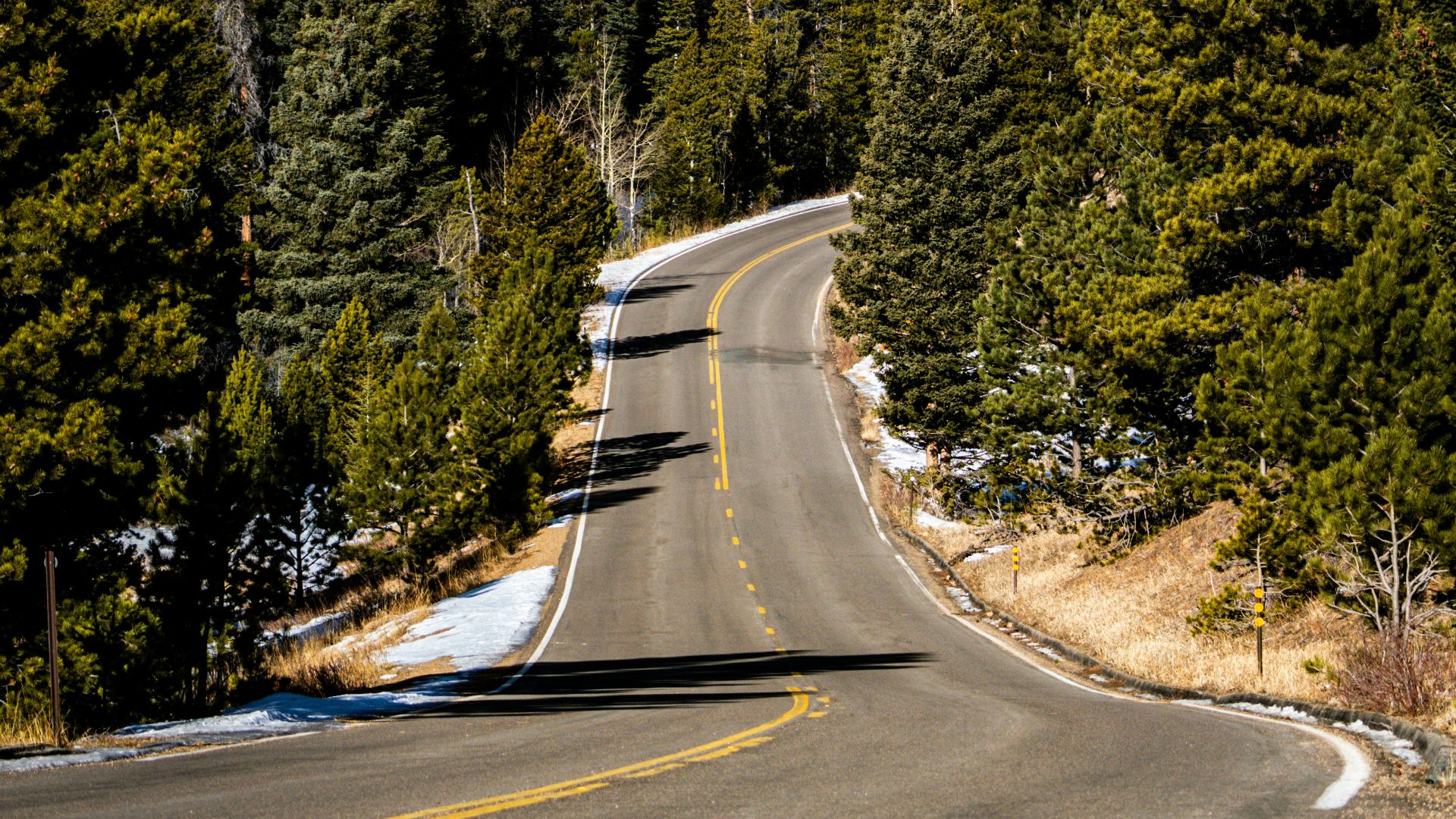 a road with a mountain in the background