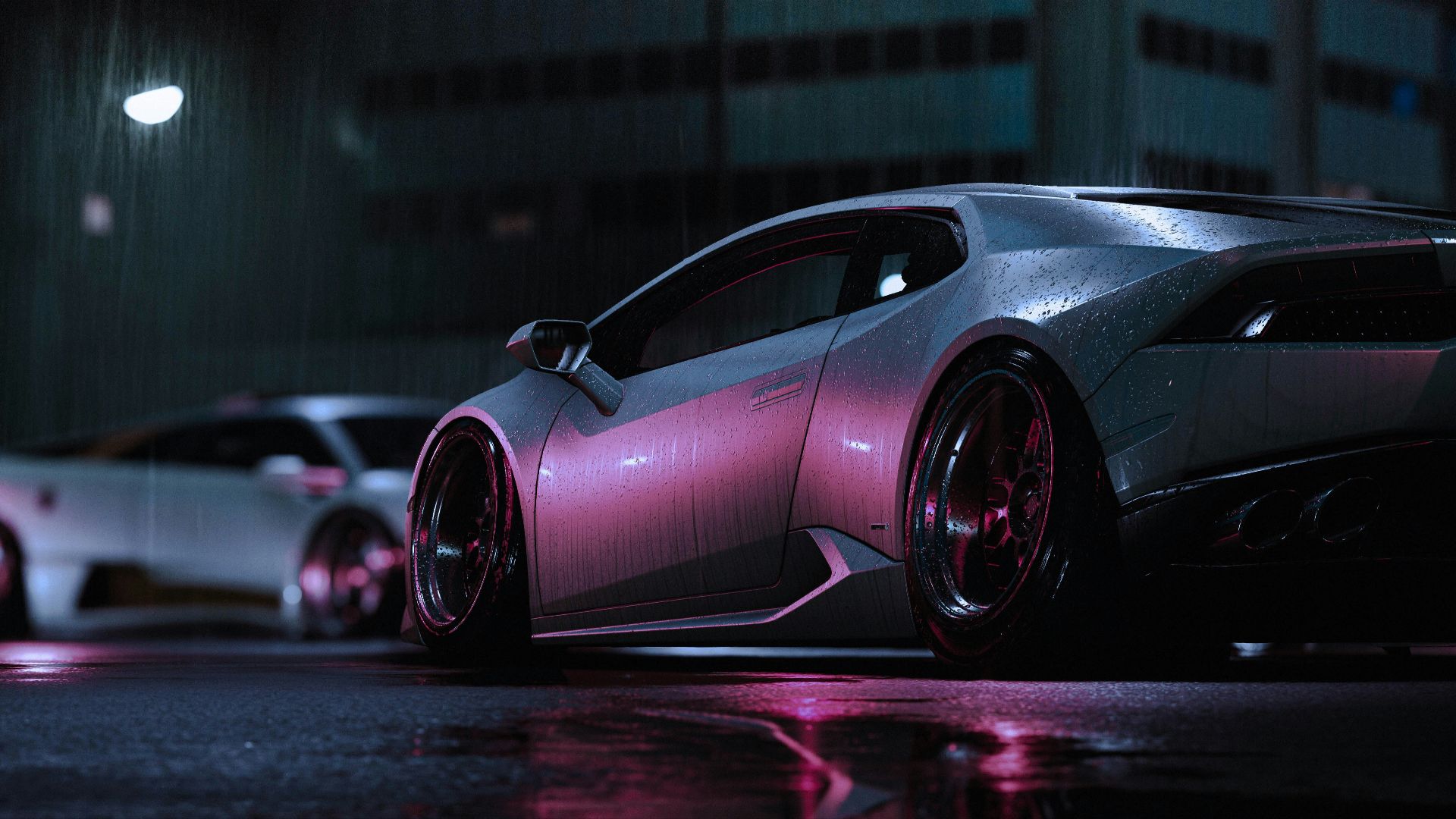 a car parked on the side of a street at night