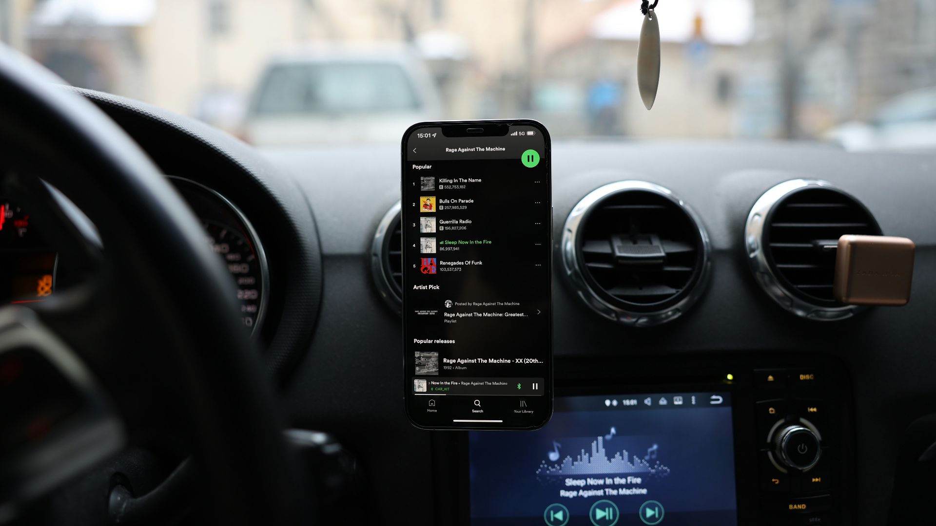 a car dashboard with a cell phone and gps