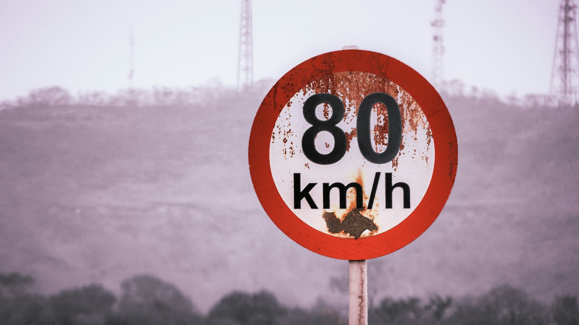 a red and white sign that reads 80 km / h
