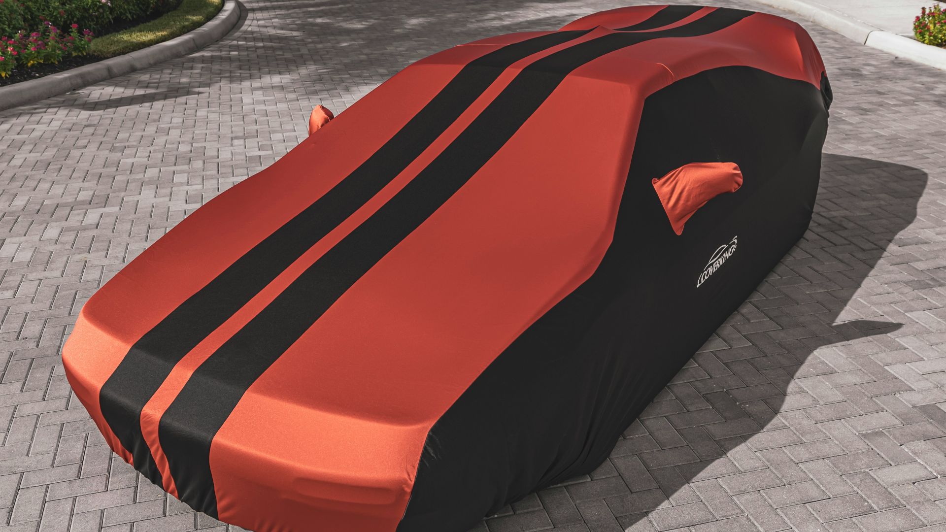 red ferrari car on gray concrete pavement