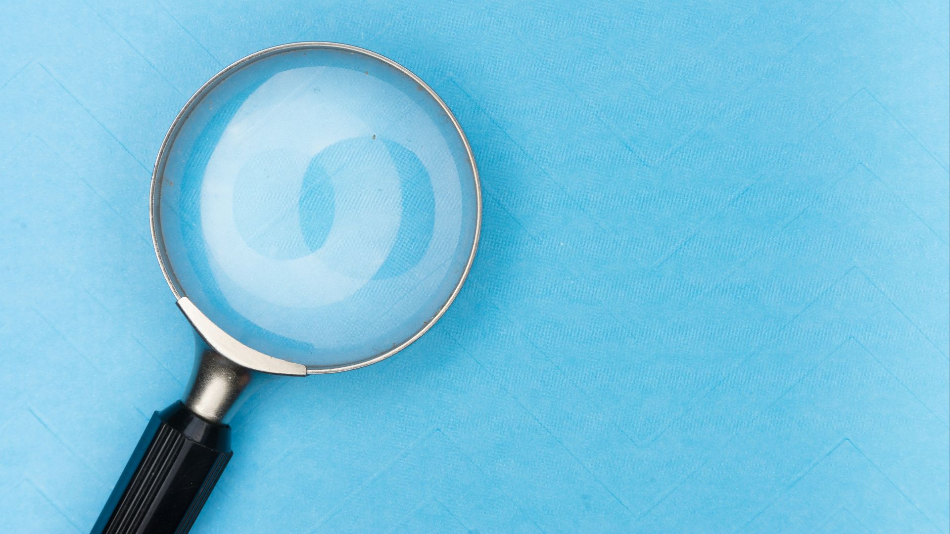 magnifying glass on white table