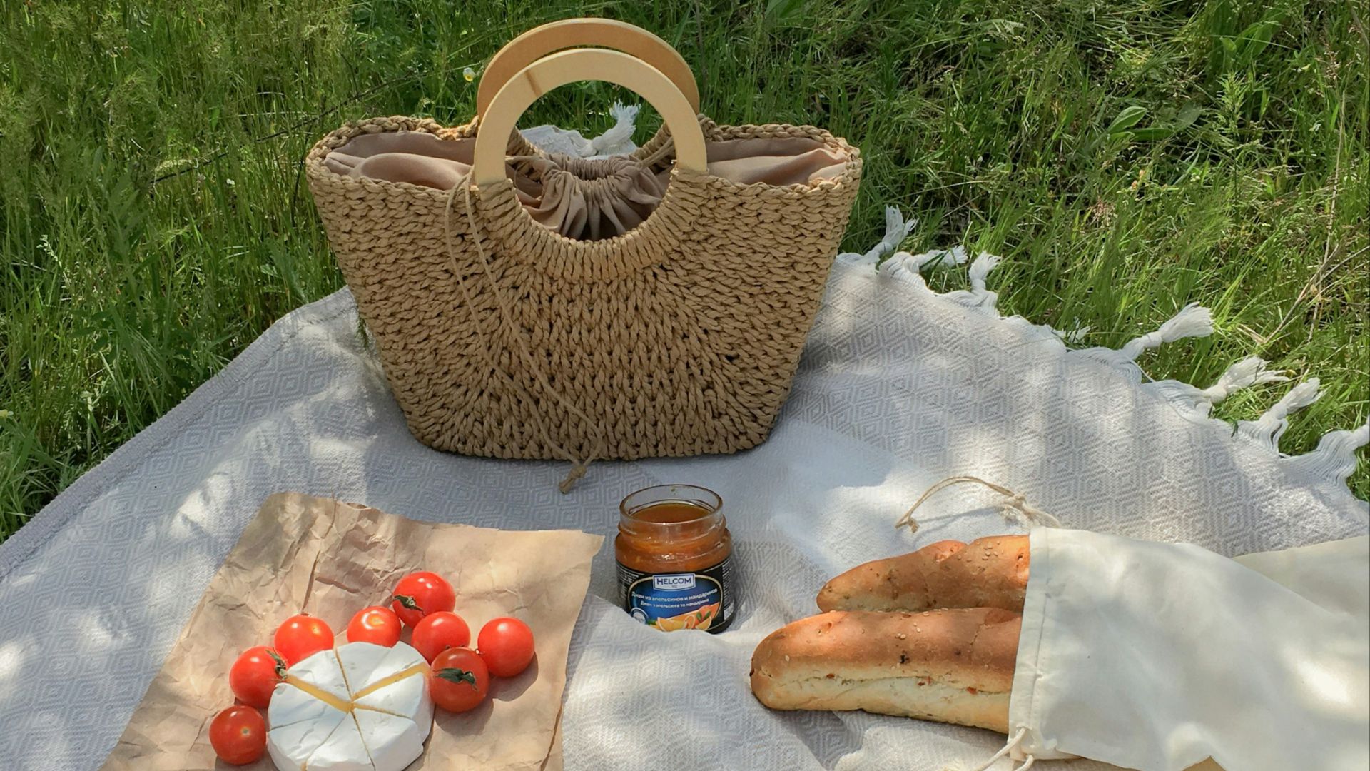 a picnic table with strawberries and bread