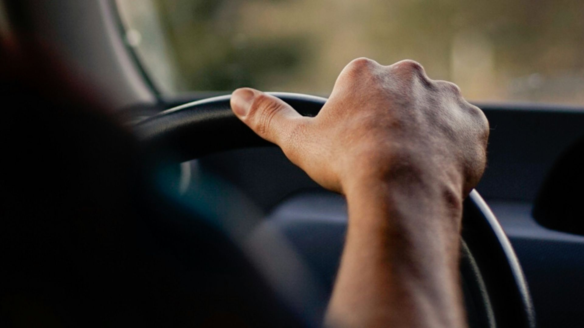 person driving car during daytime