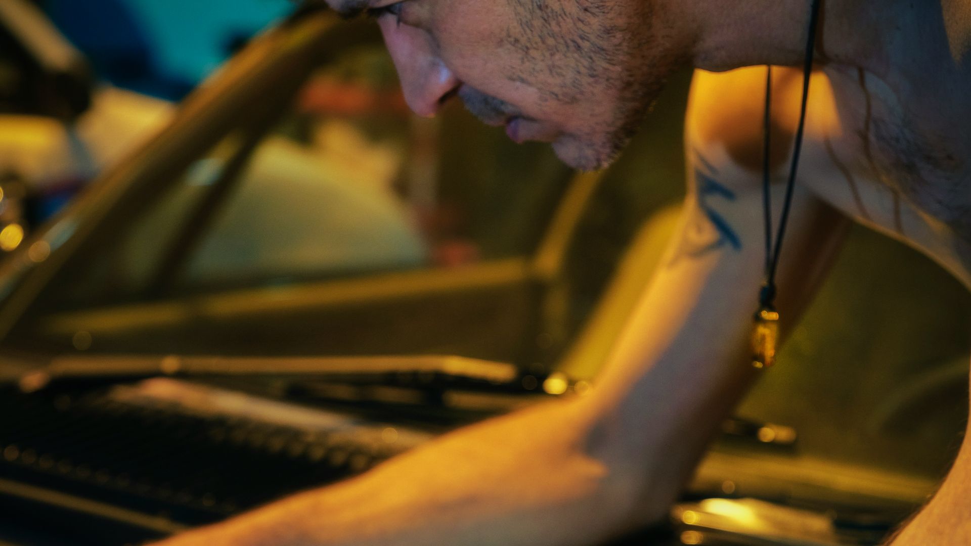 man in black tank top wearing black sunglasses