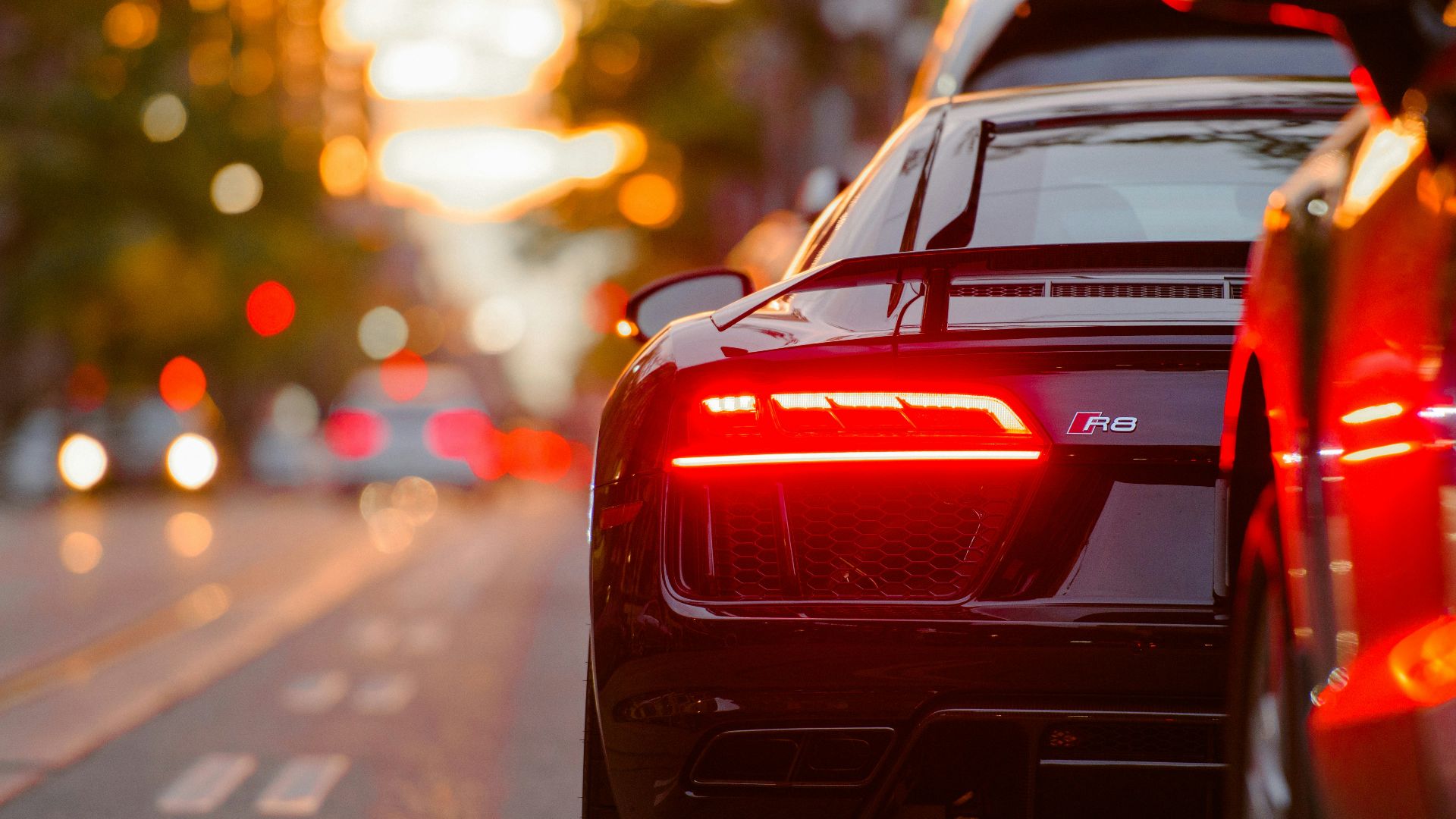 black Audi R8 parked beside road