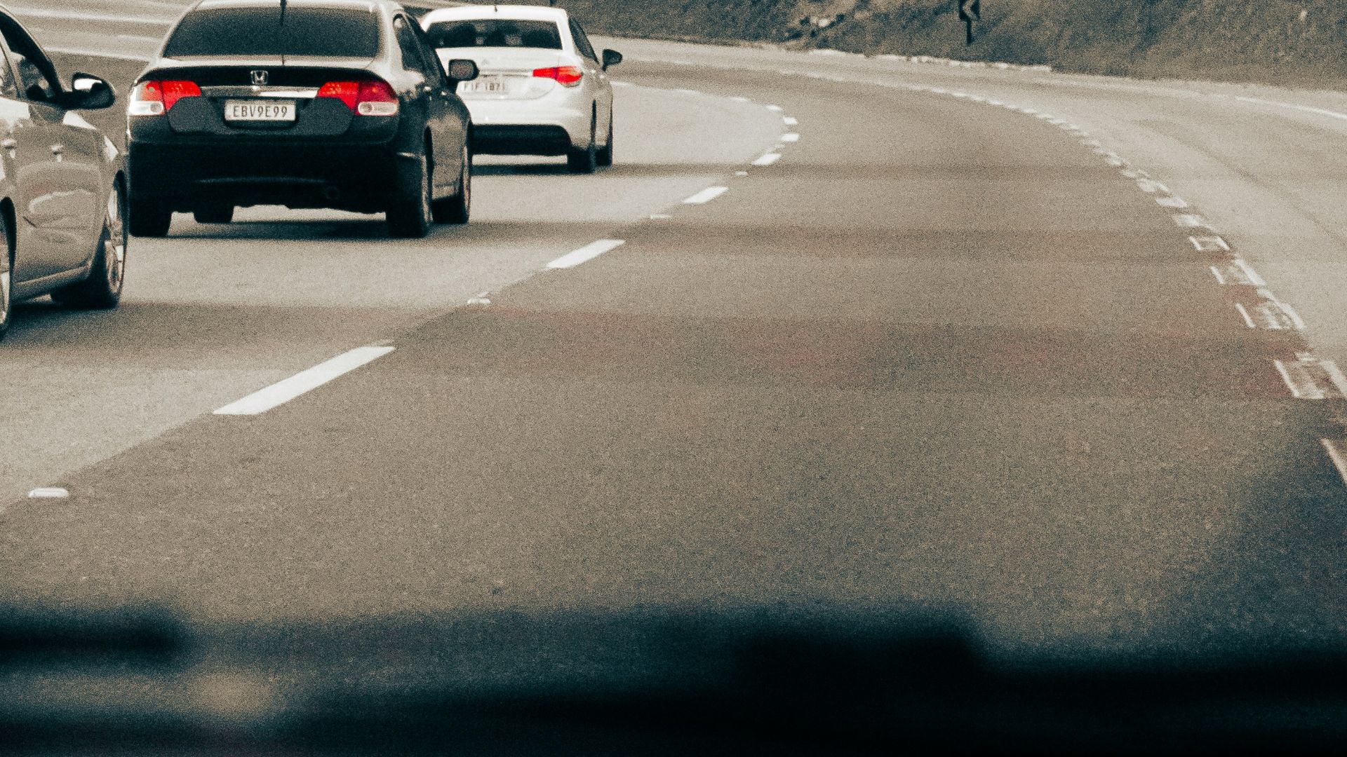 a group of cars on a road