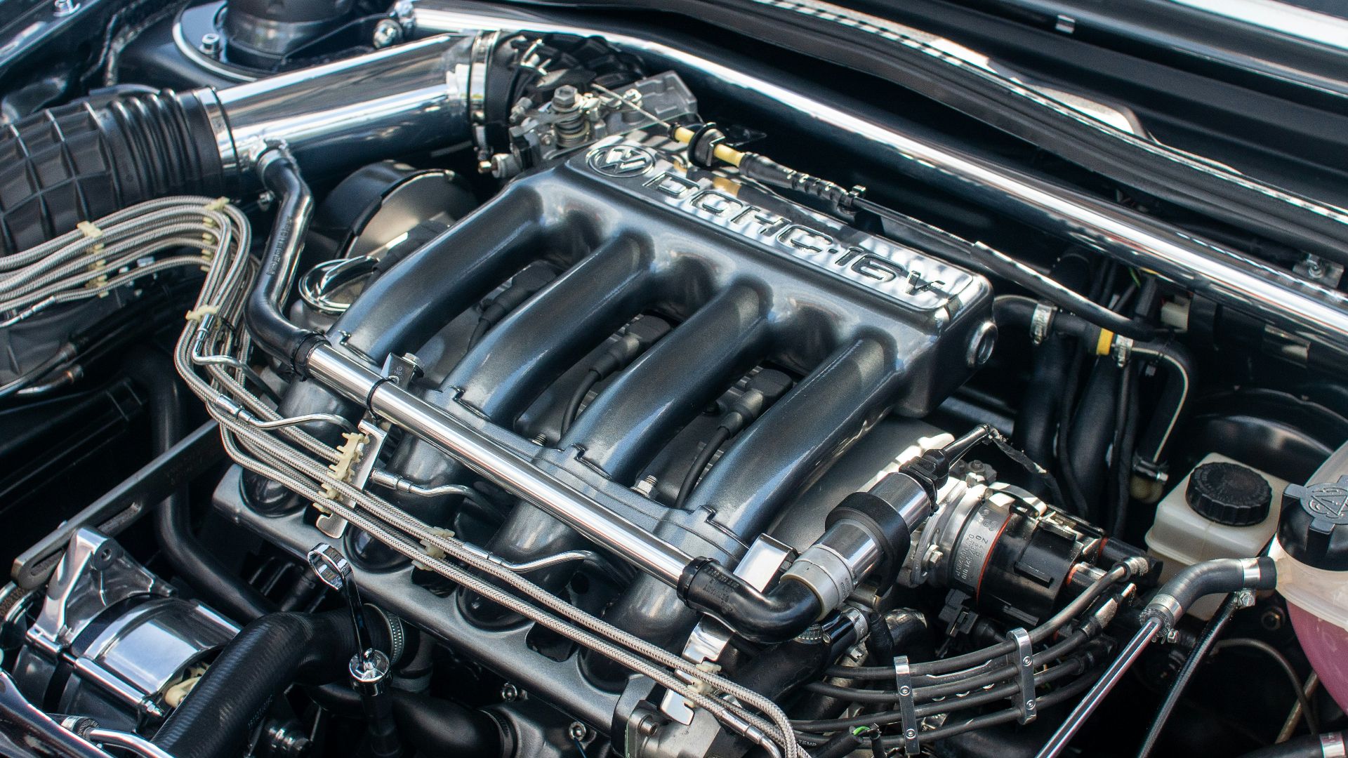 The engine compartment of a car with the hood up