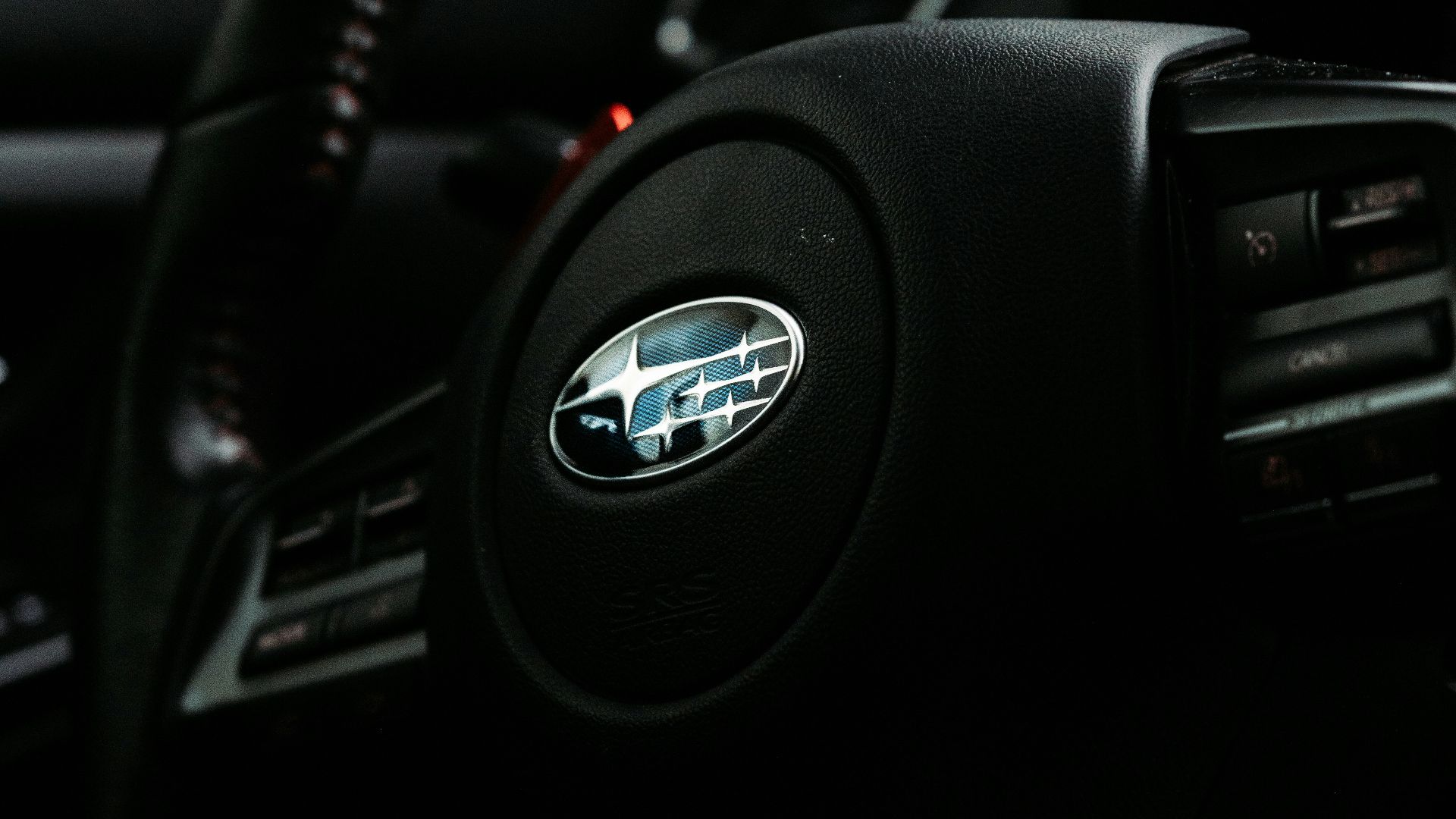 black nissan car steering wheel