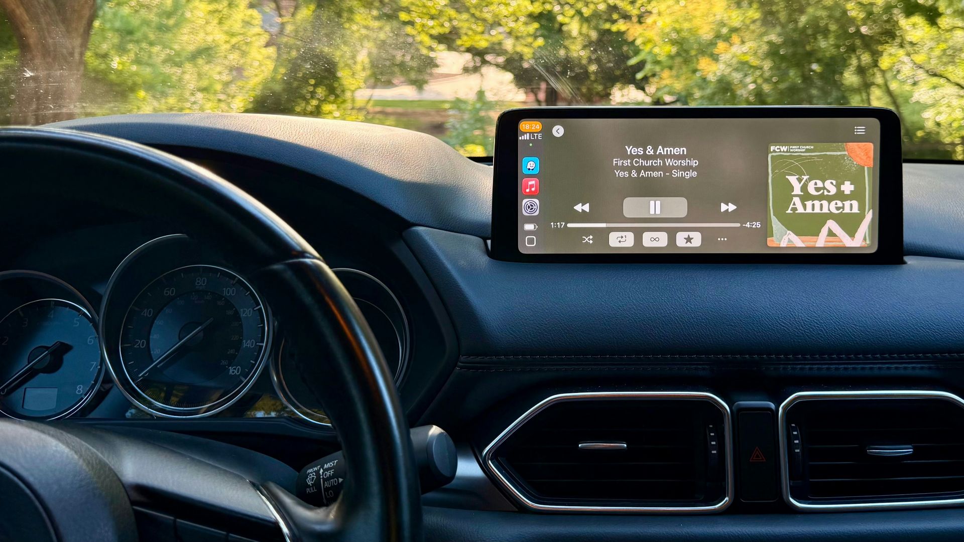 Car dashboard displays music while parked.