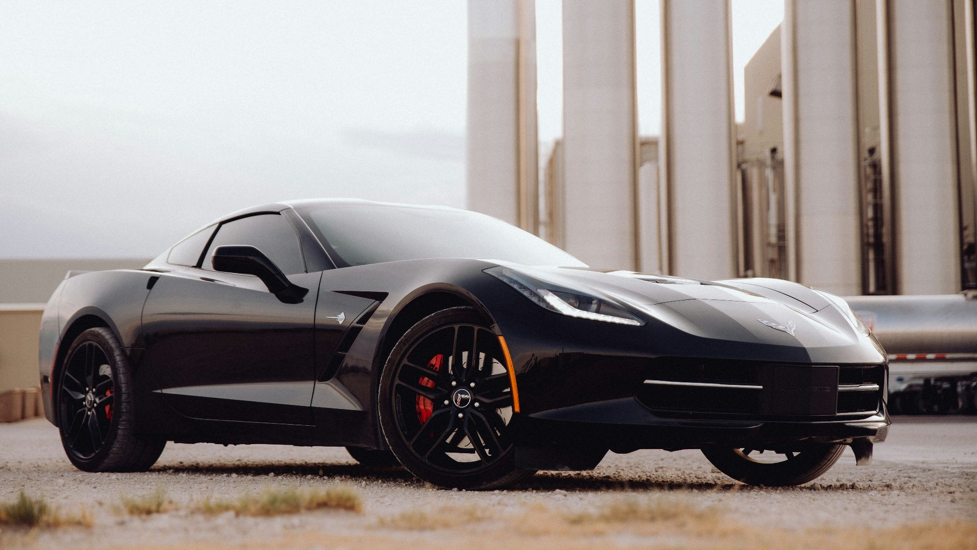 black lamborghini aventador parked on brown field during daytime