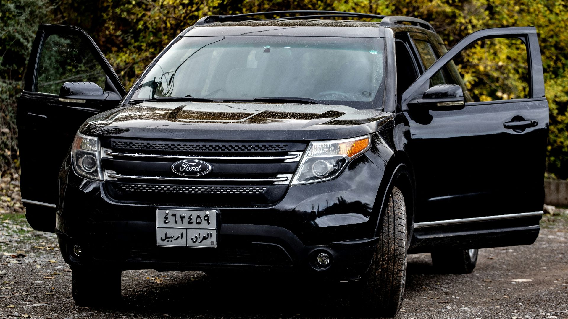 a black car with its doors open