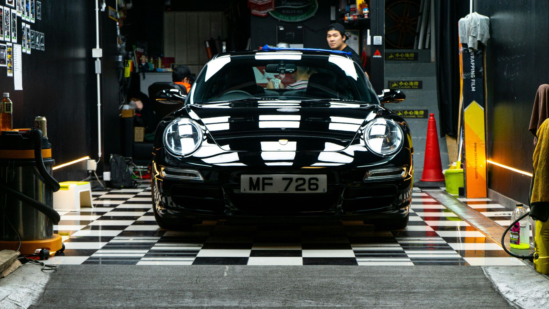 black porsche 911 parked on street during daytime