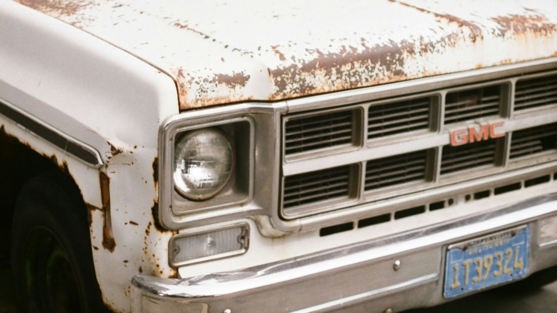 white car with white and brown paint