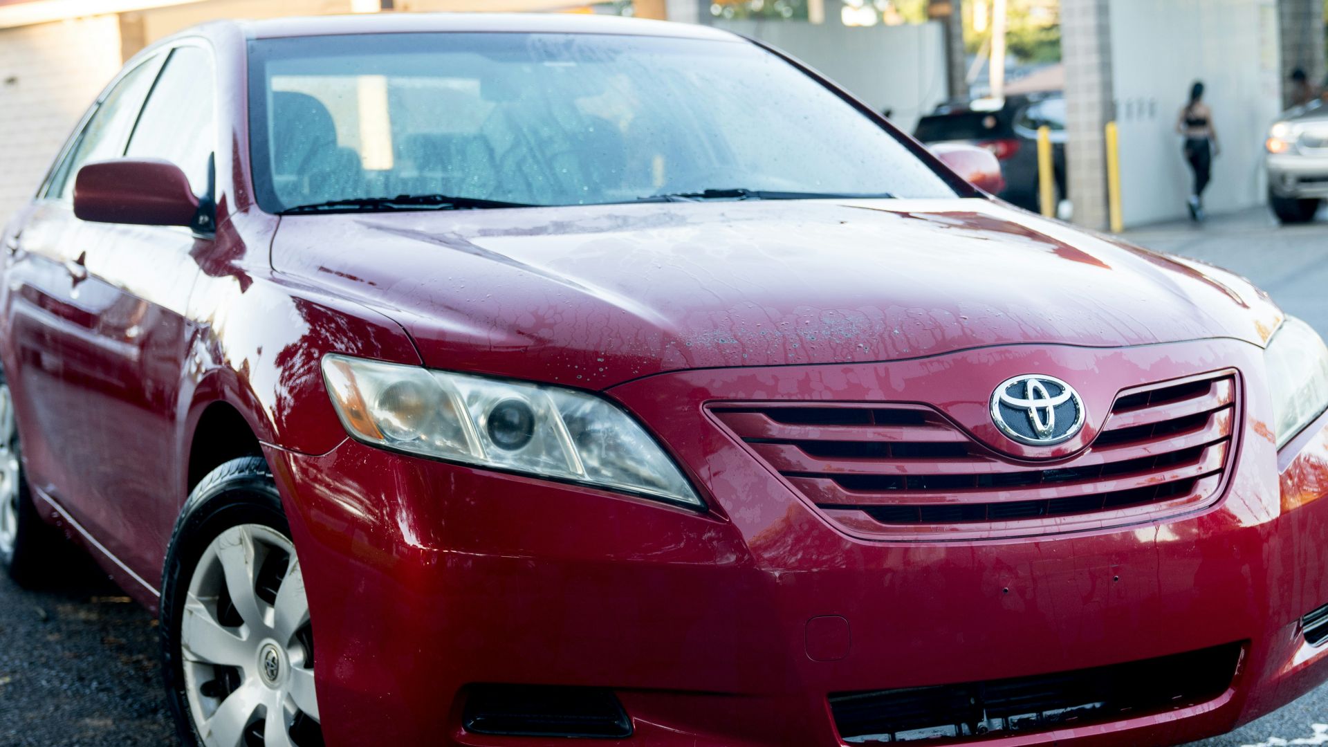 a red car parked in a parking lot