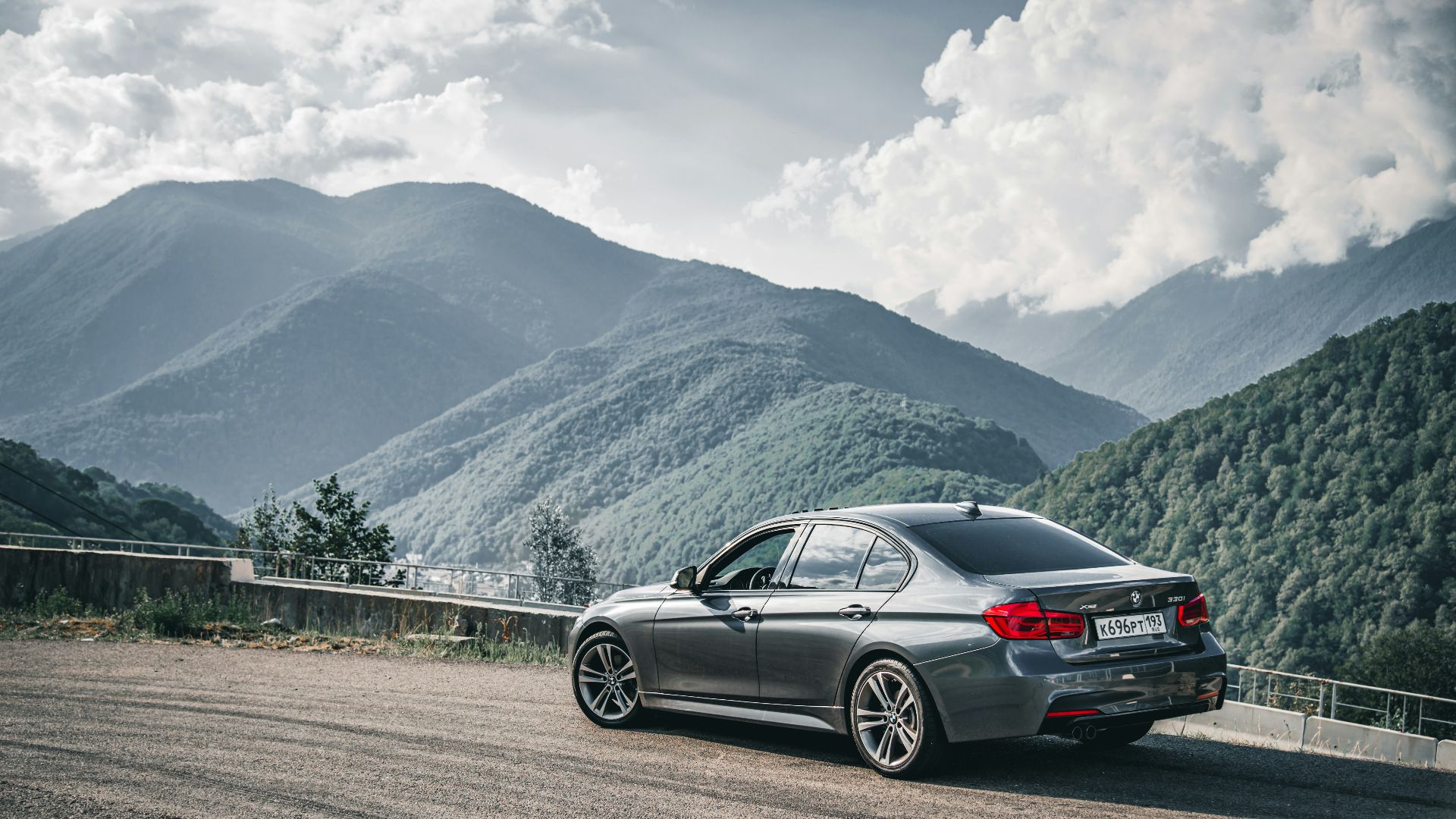 a silver car parked on the side of a road
