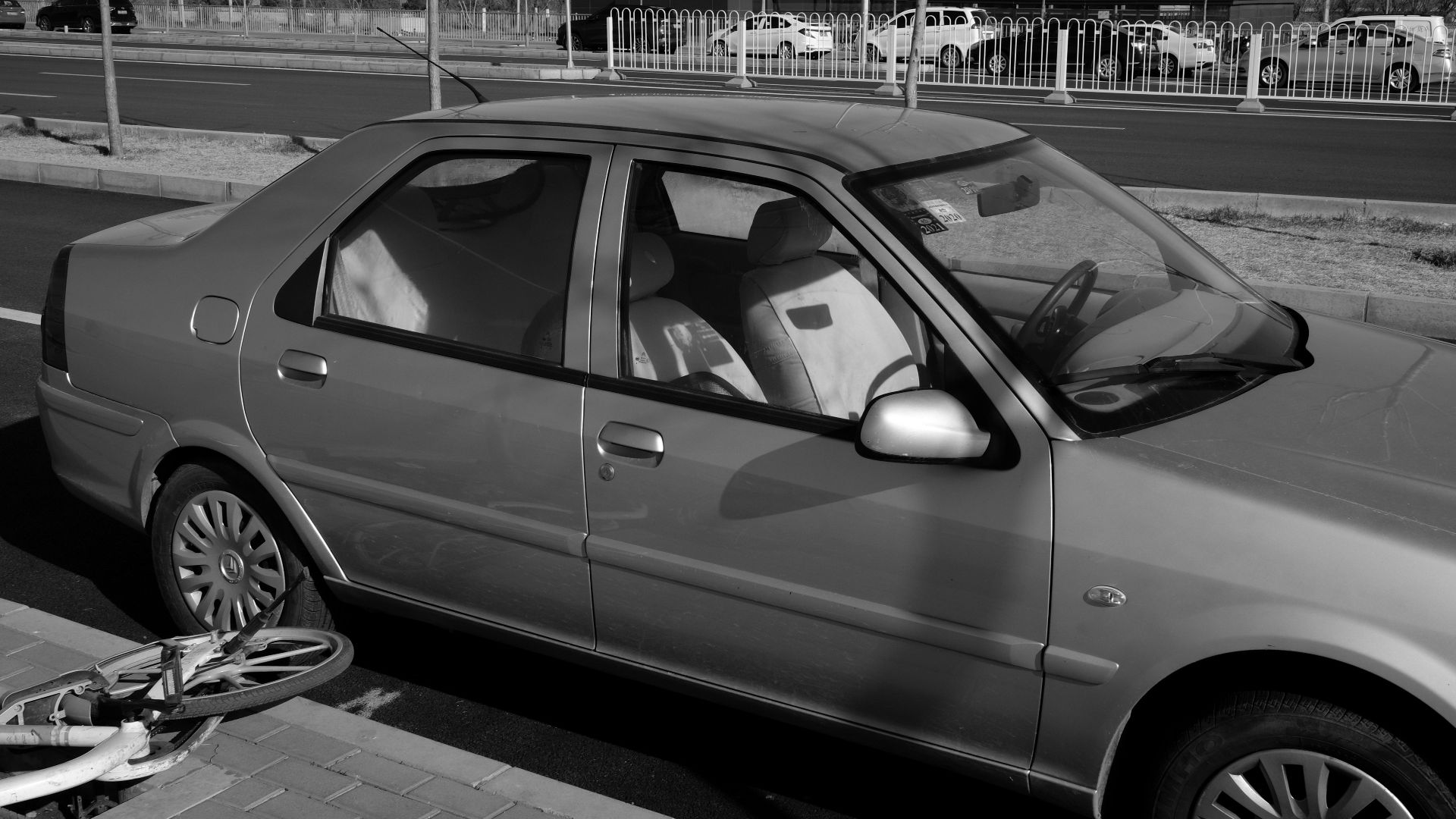 grayscale photo of car on road