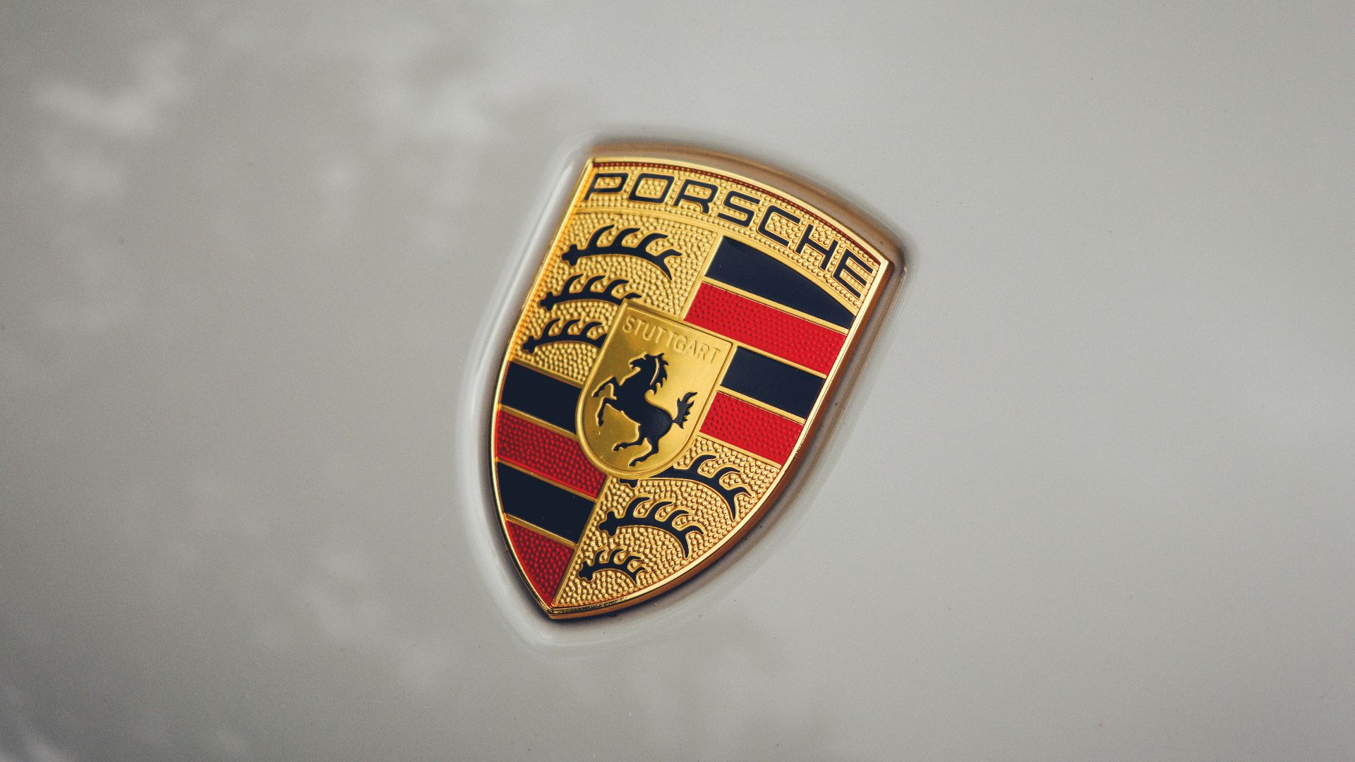 a close up of a porsche emblem on a car