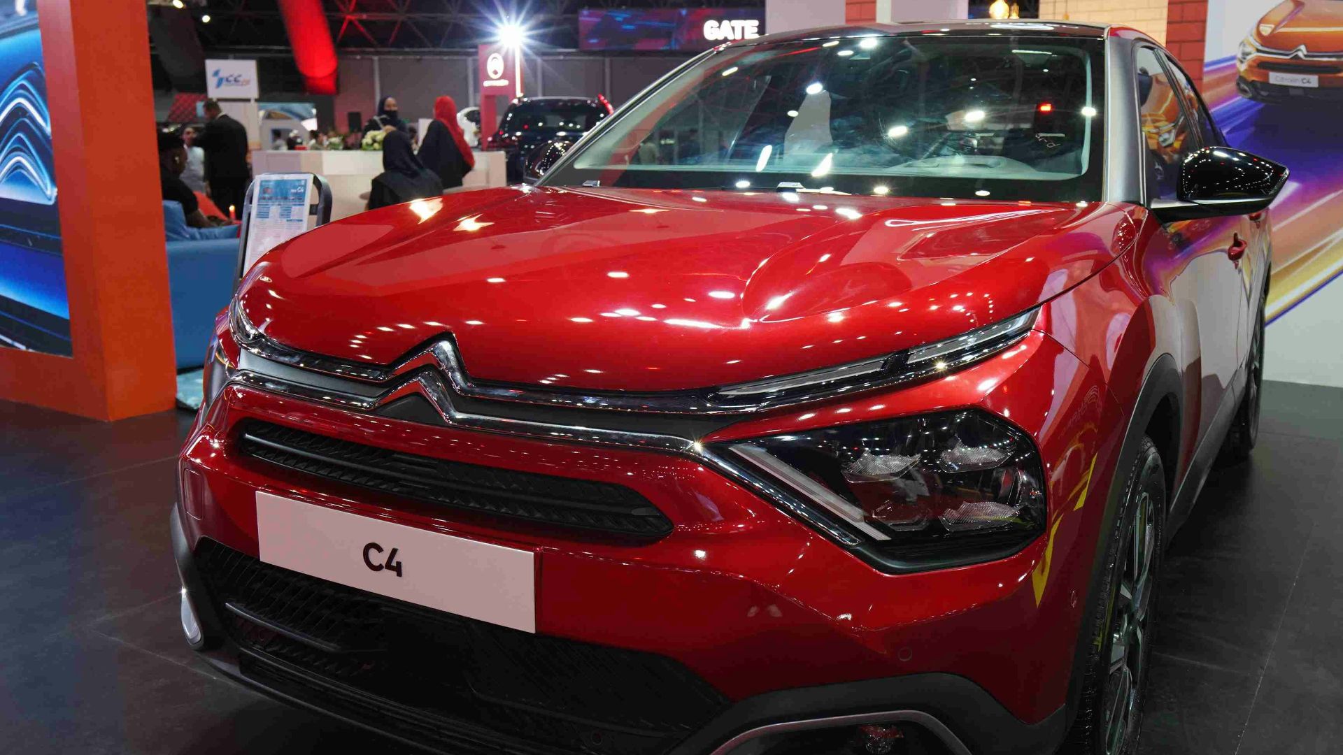 A red car on display at a car show