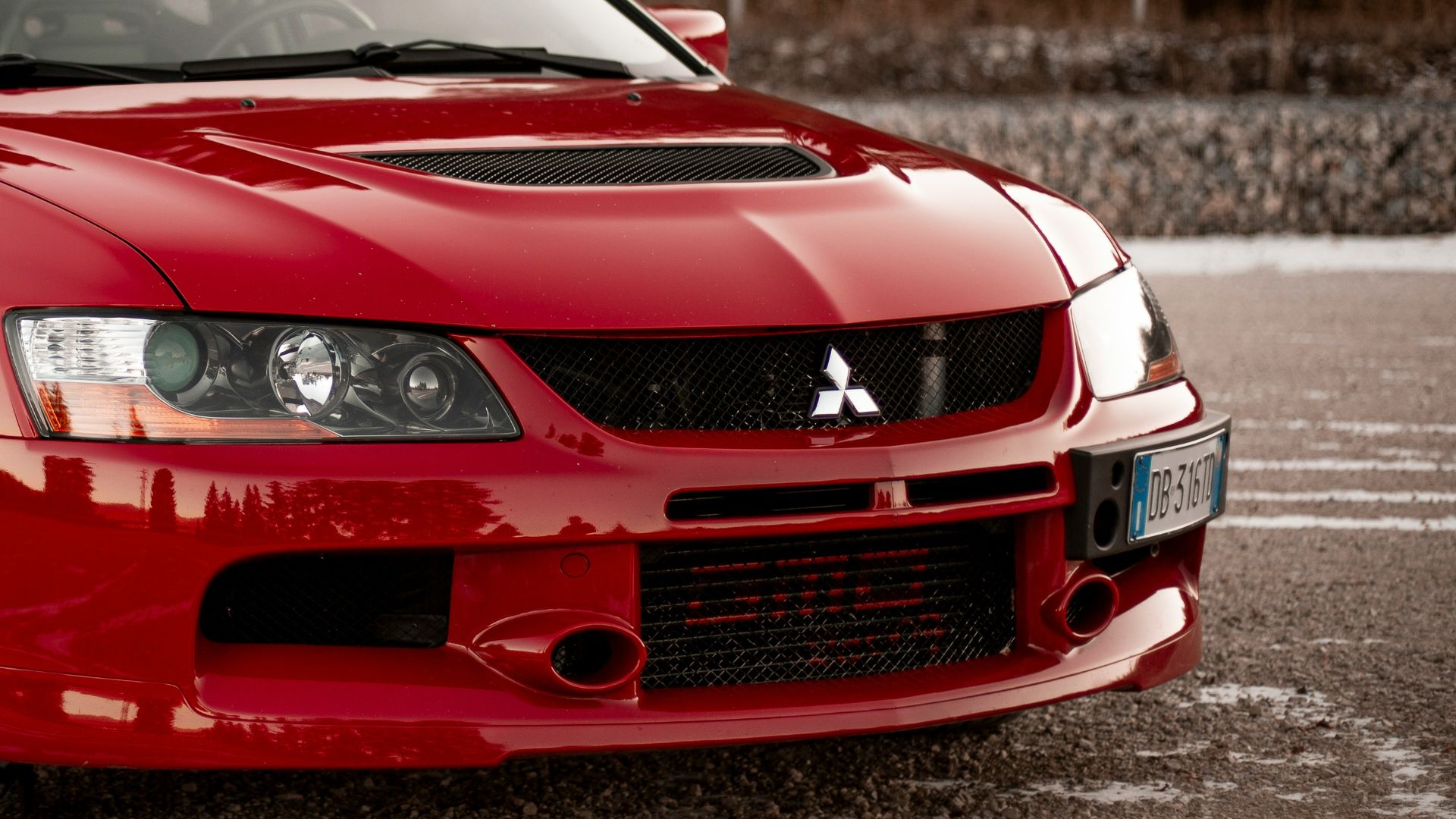 red chevrolet camaro on road during daytime