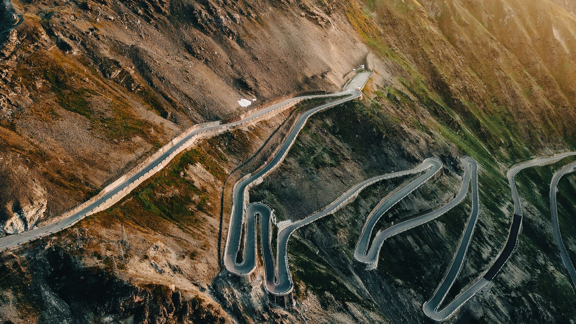 an aerial view of a winding mountain road