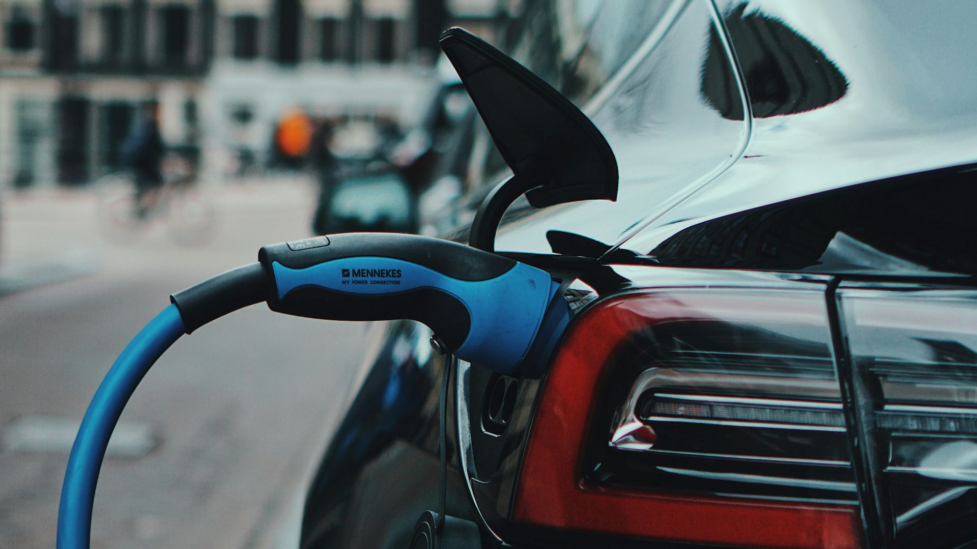 white and black car in front of white building during daytime
