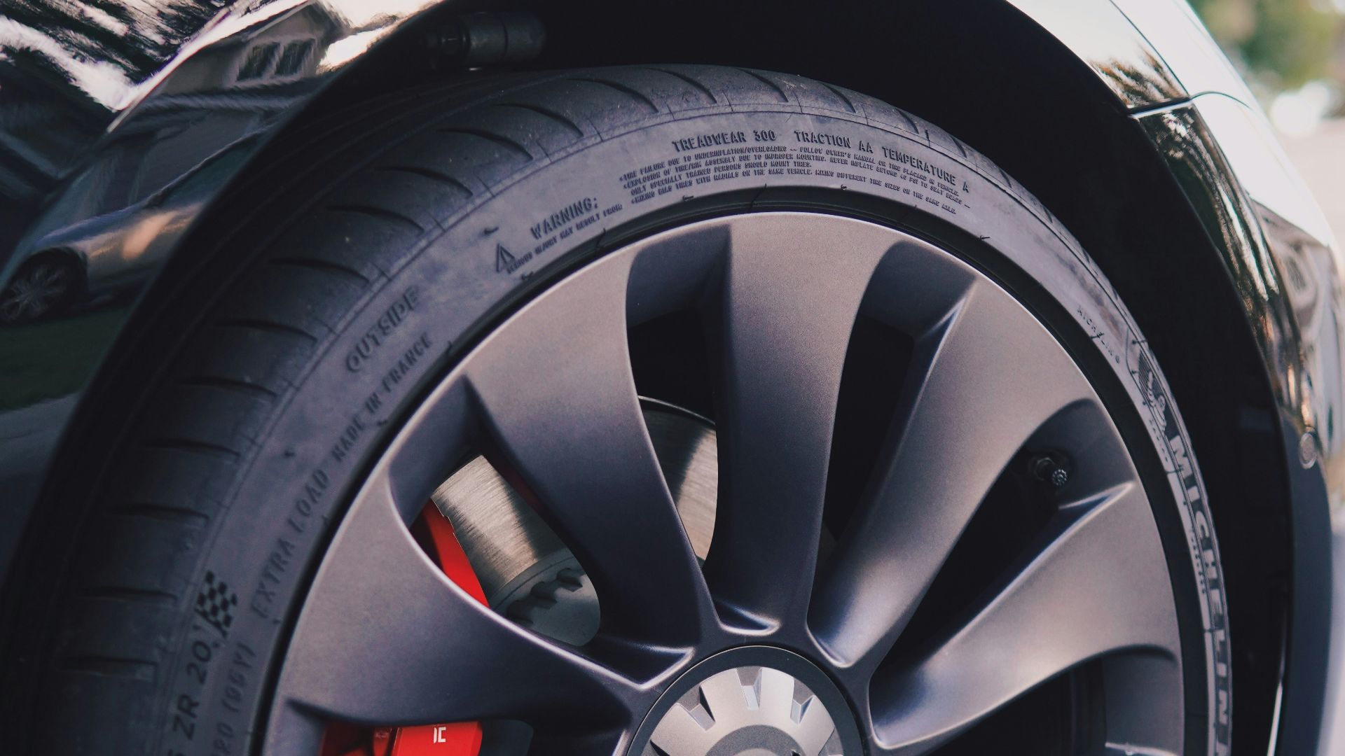 a close up of a car tire on a street