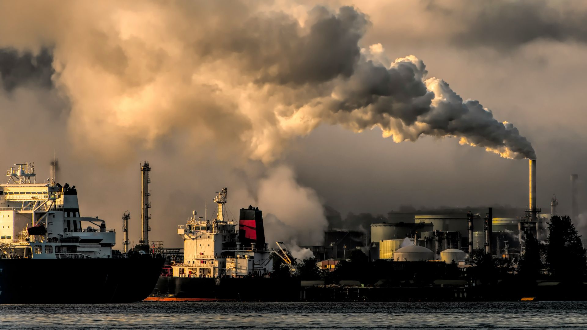 white and black ship on sea under white clouds