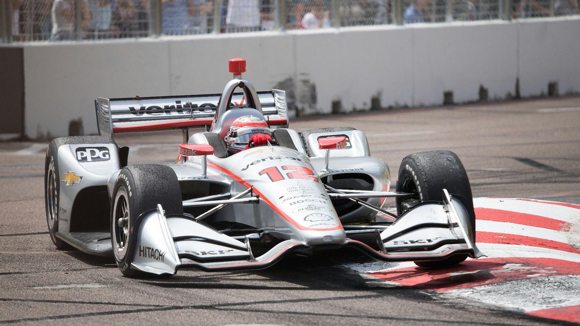 white and red f 1 car on road