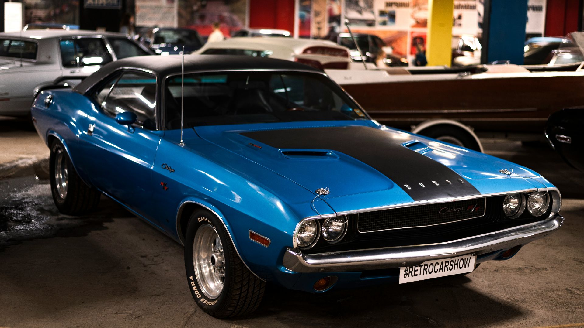 a blue car parked in a showroom
