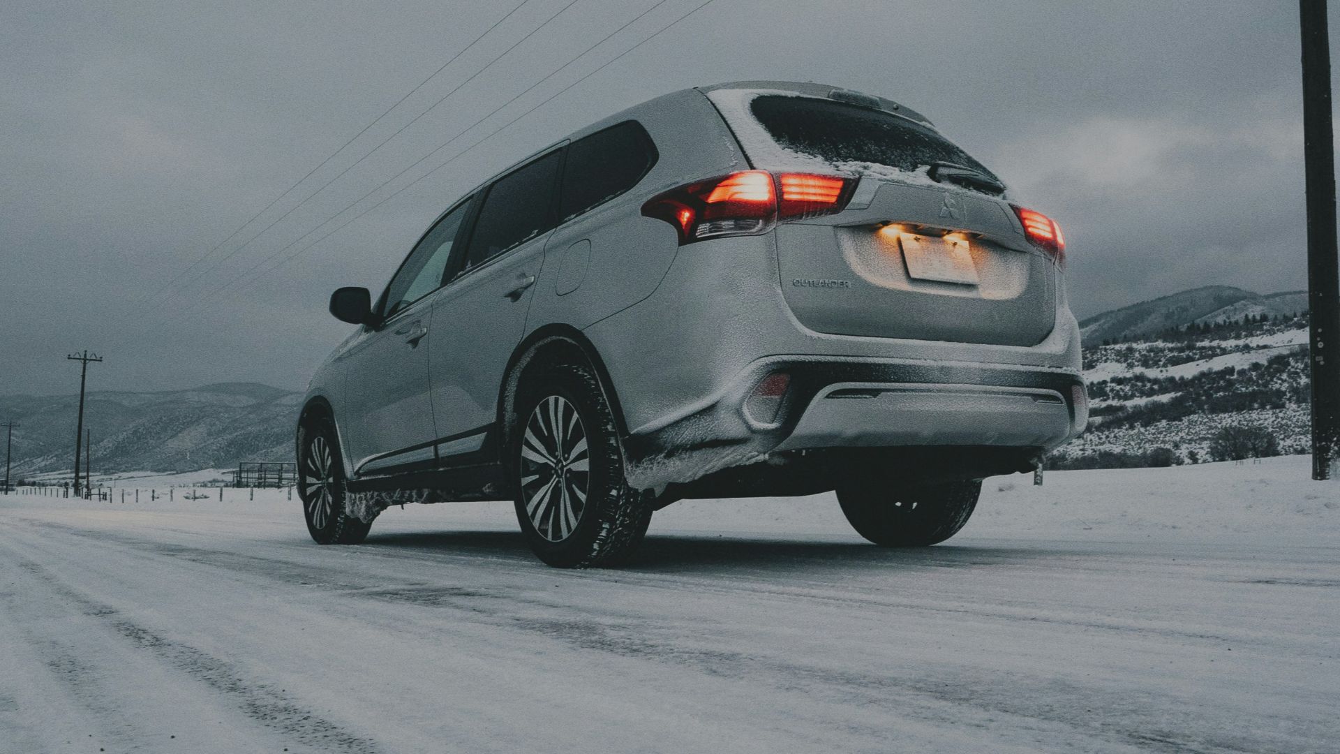 gray vehicle on snow field
