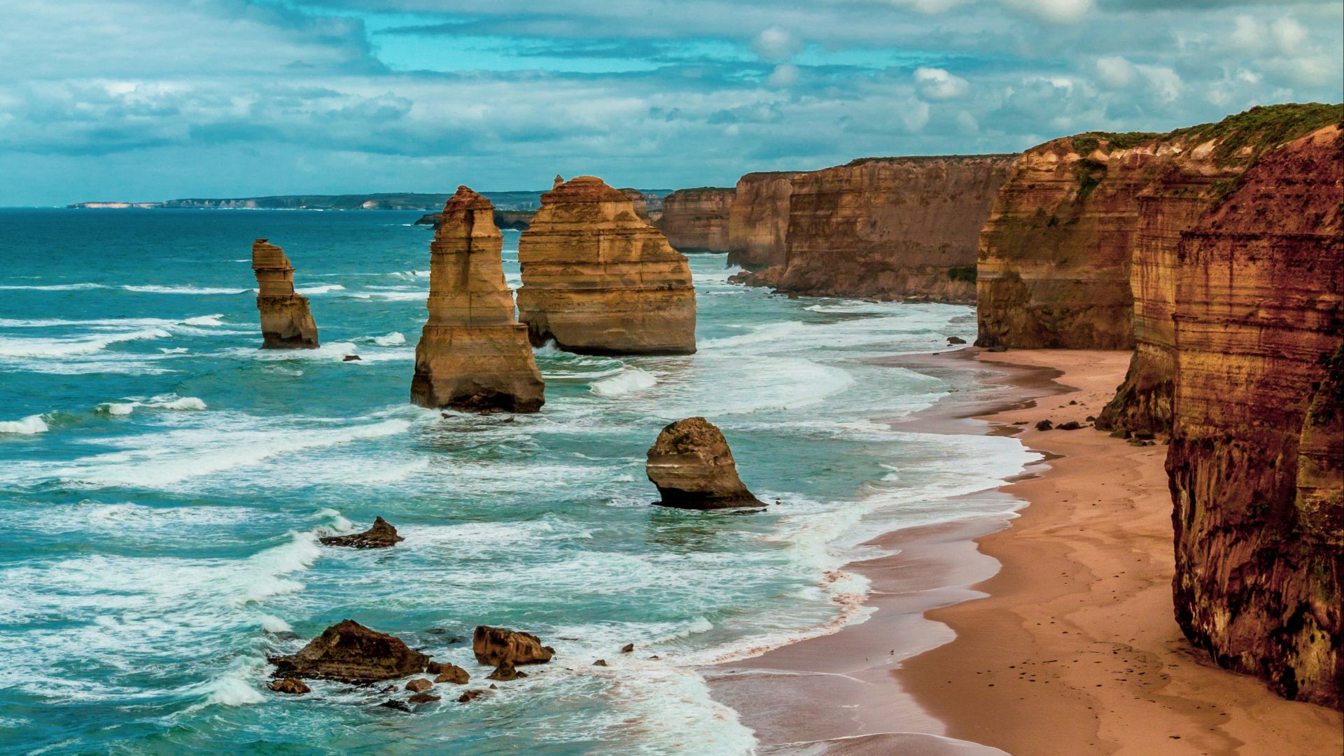 brown rock formation on sea shore during daytime
