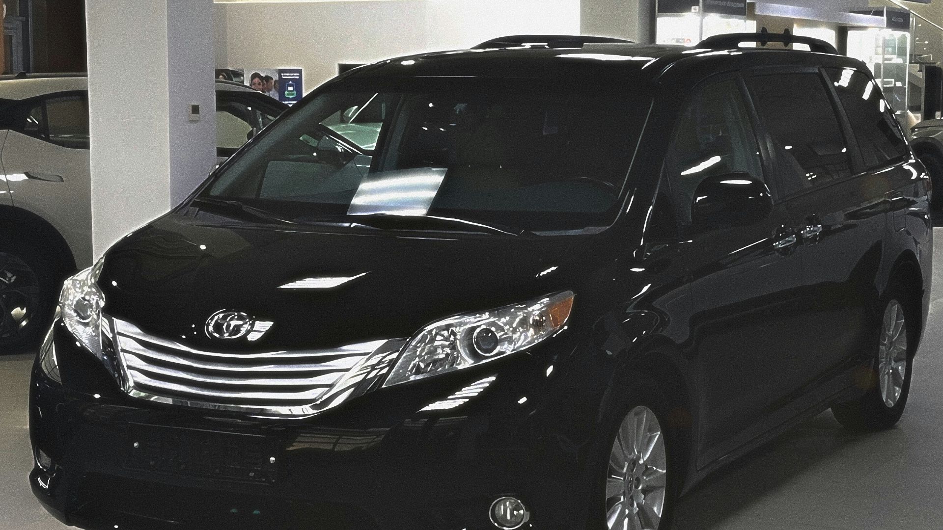 A car showroom filled with lots of cars