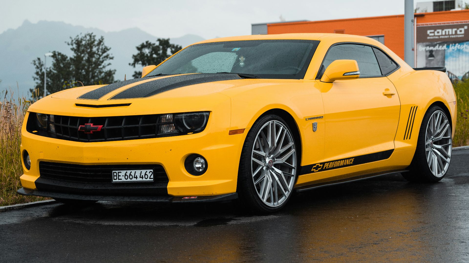 yellow Chevrolet coupe close-up photography
