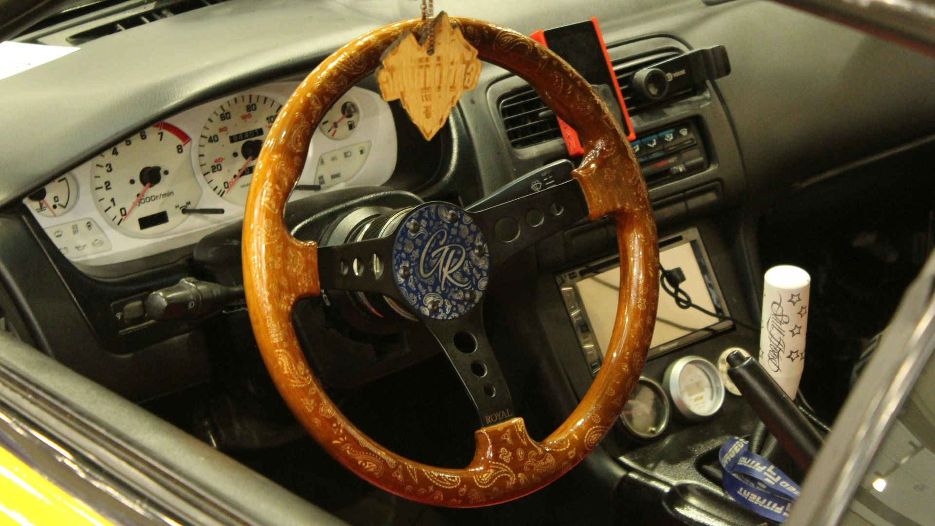 a steering wheel and dashboard of a car