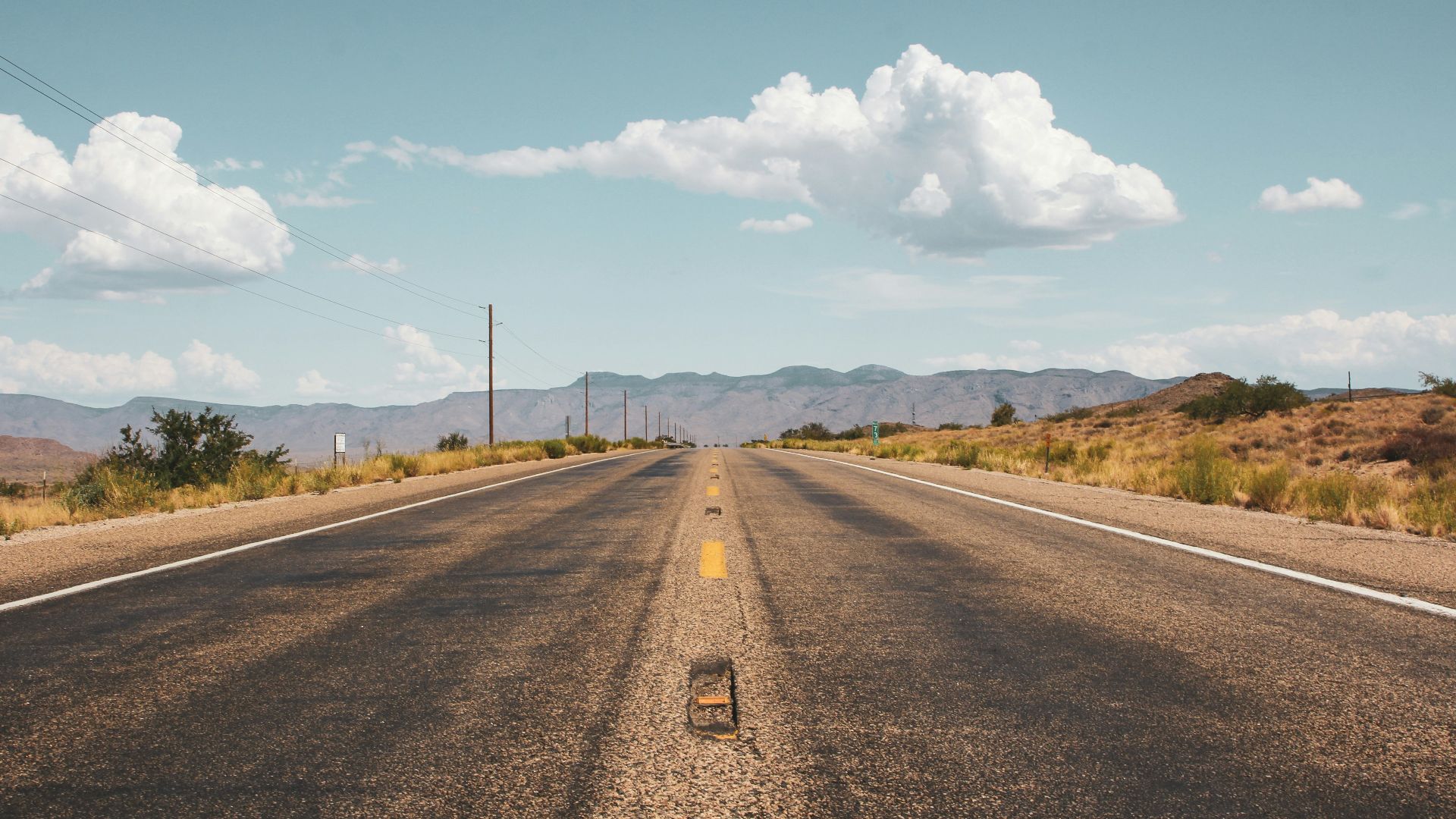 empty road under blue sky
