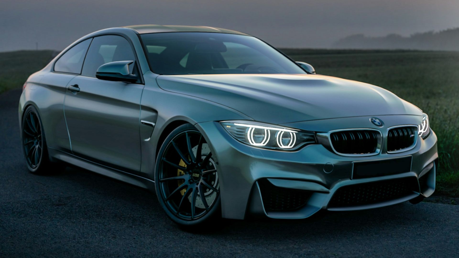 gray mercedes benz coupe on black asphalt road during daytime