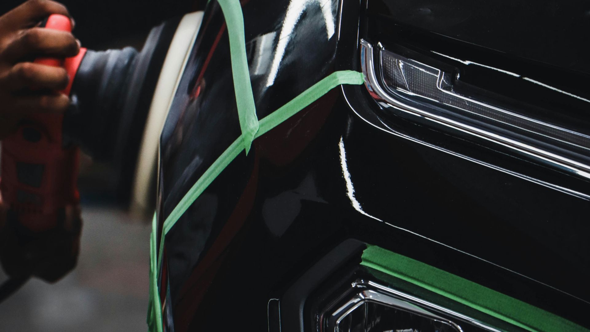 person holding car steering wheel