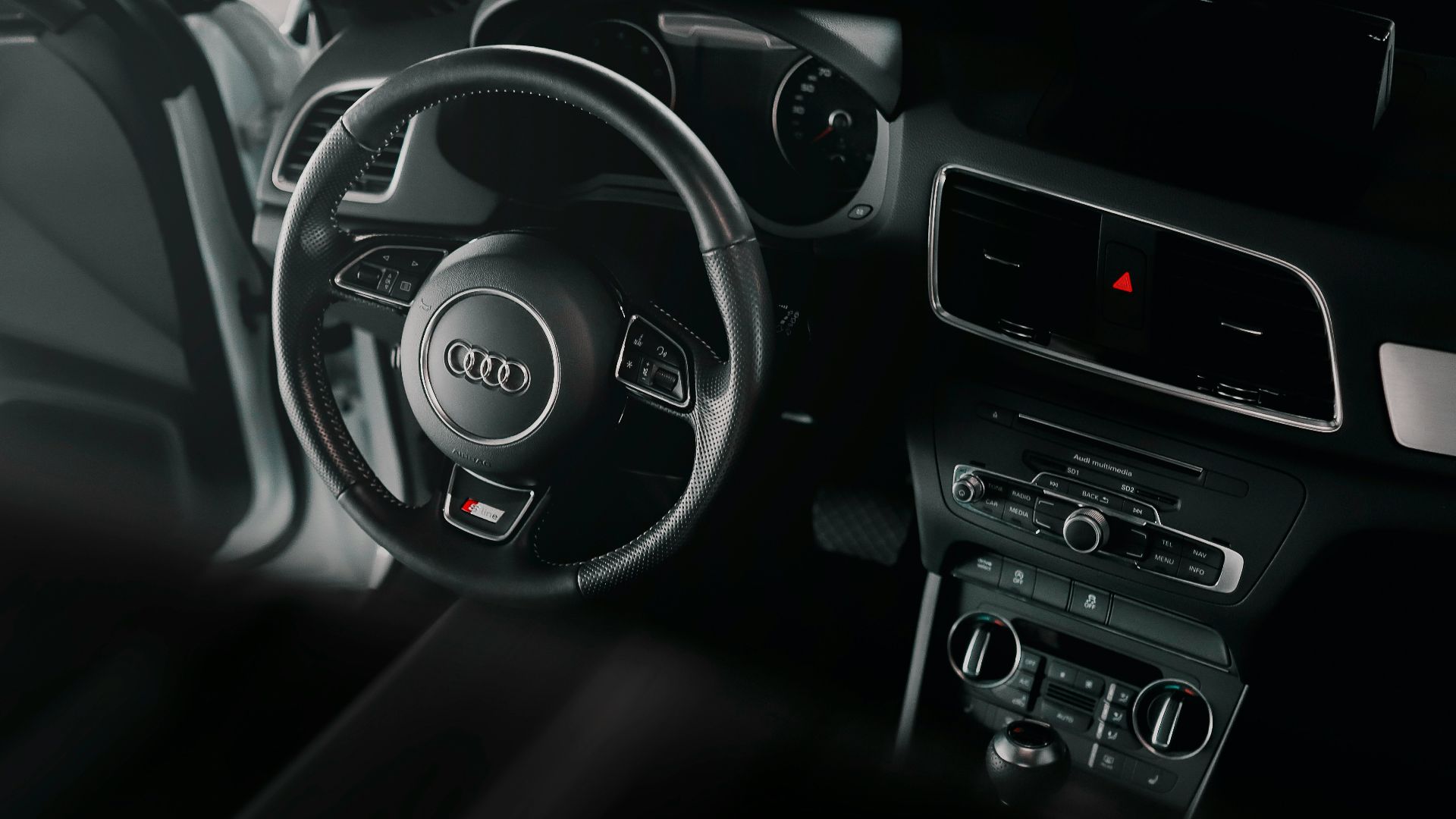 black and silver mercedes benz steering wheel