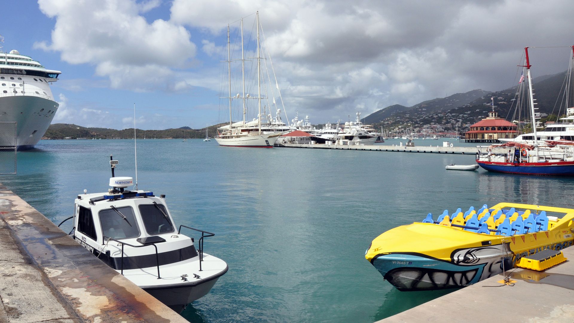 a boat is docked next to a body of water