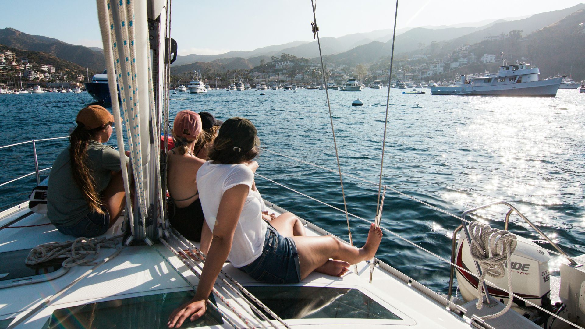 people sitting on front of yacht