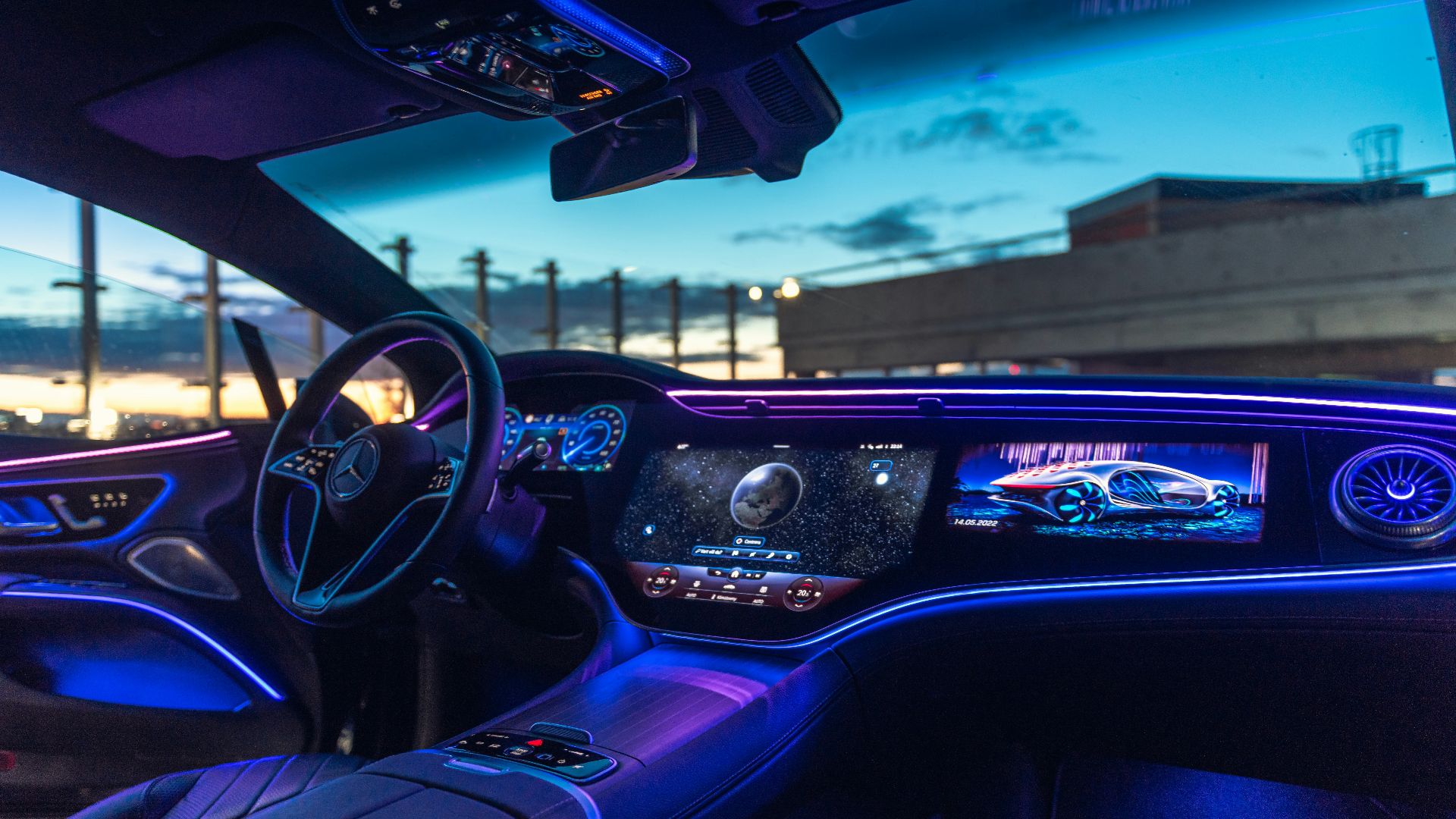 the interior of a car with blue lights