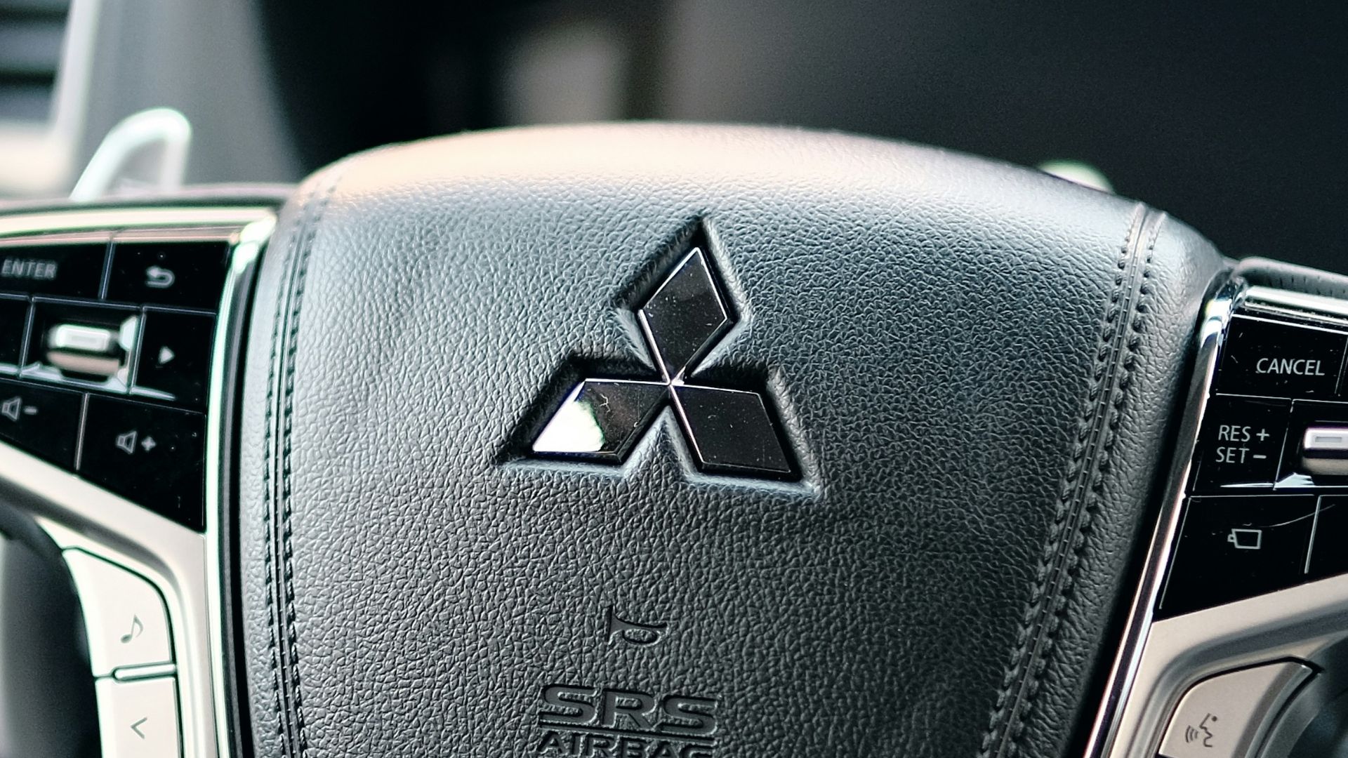 black honda steering wheel in close up photography