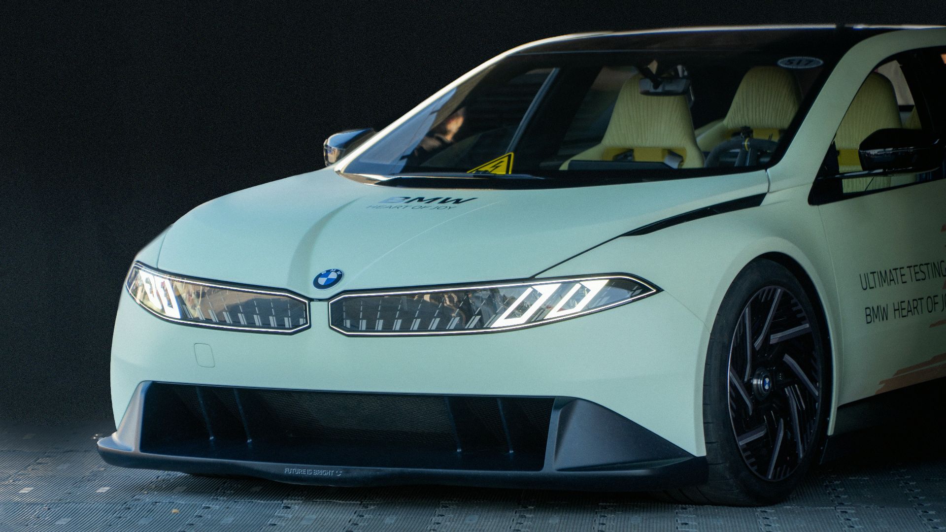 A white BMW car is shown.