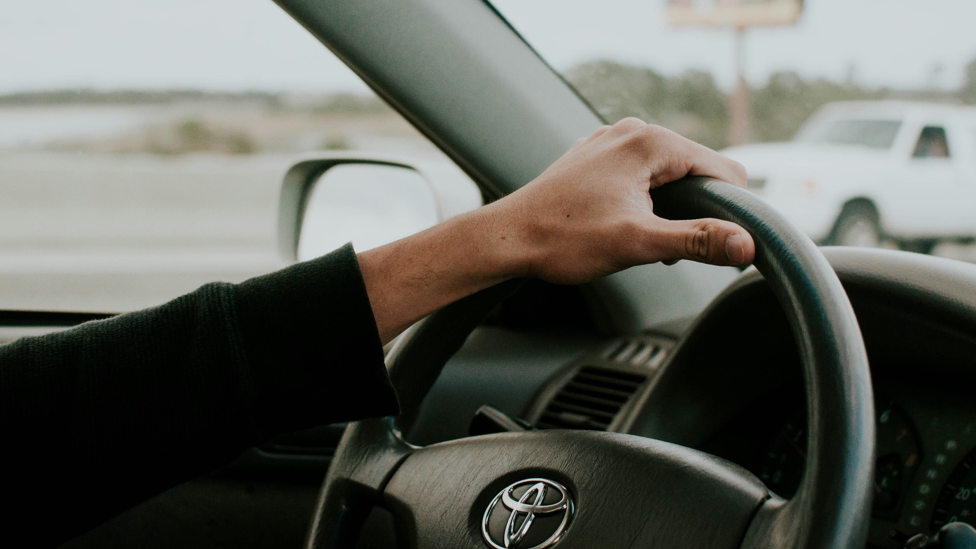 person driving Toyota car