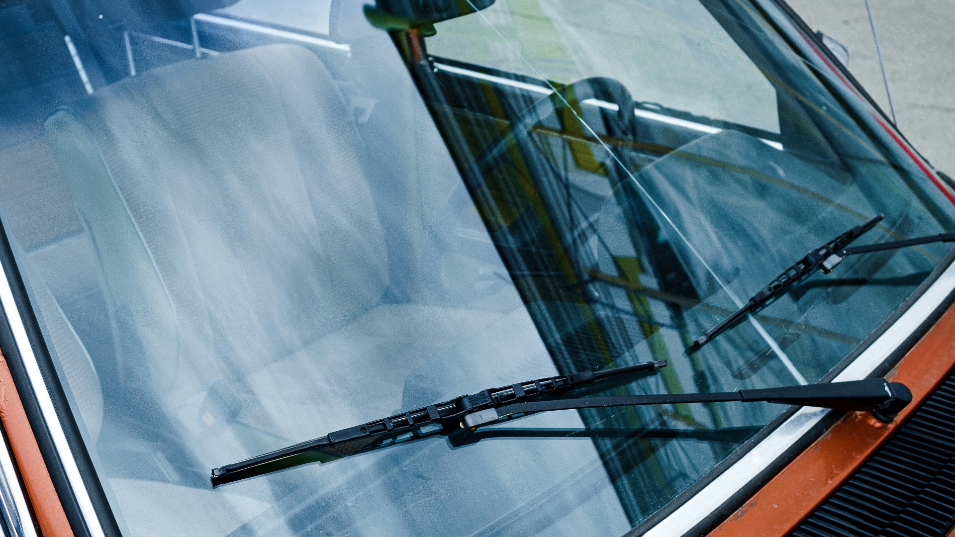 black car door with white window blinds