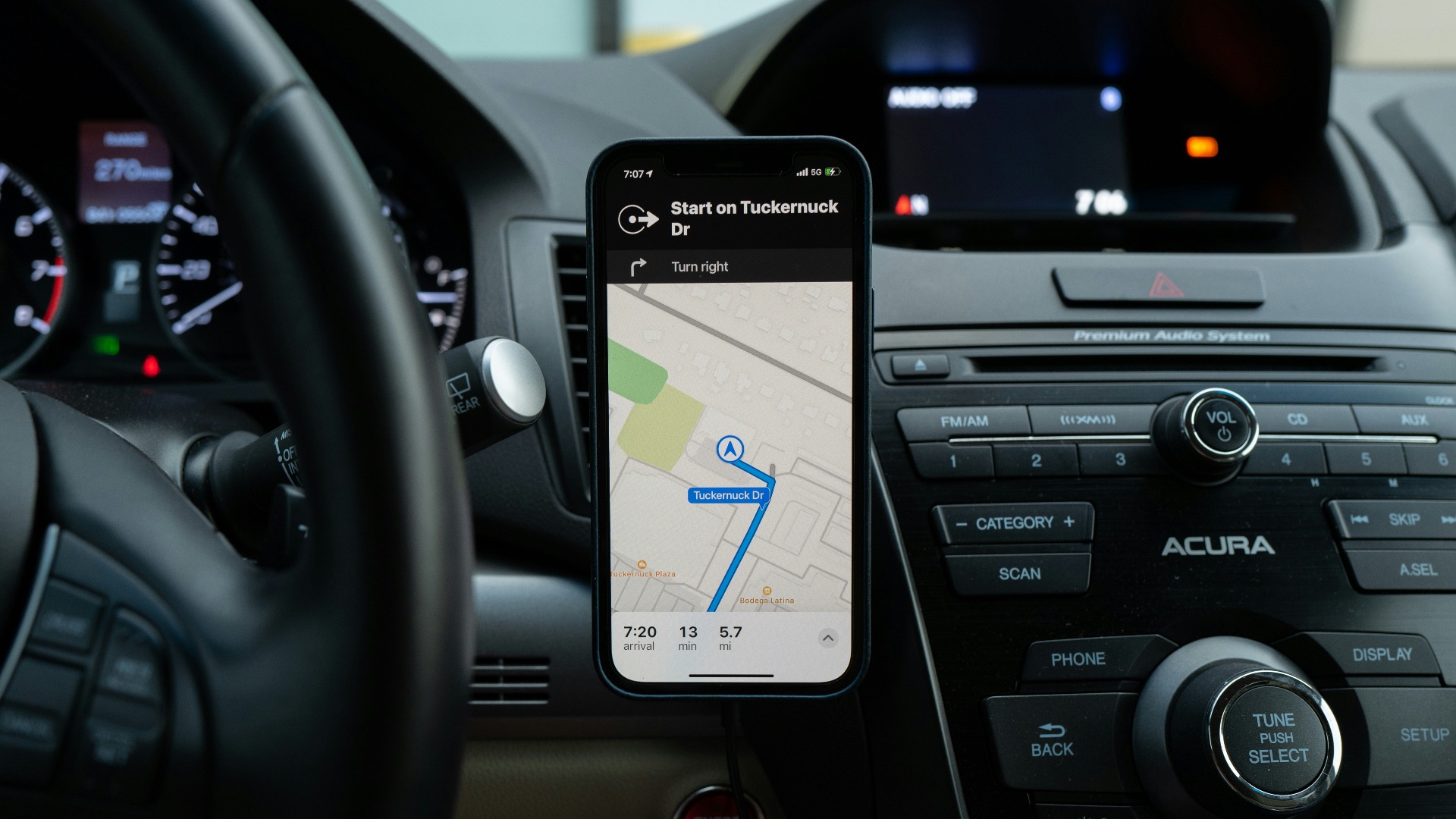 black android smartphone on car center console