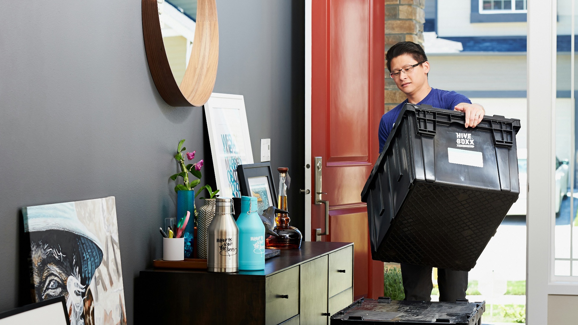 man in blue polo shirt sitting on chair