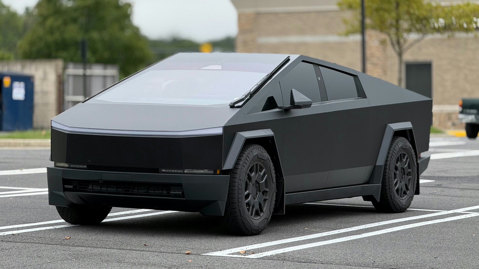 A futuristic car is parked in a parking lot