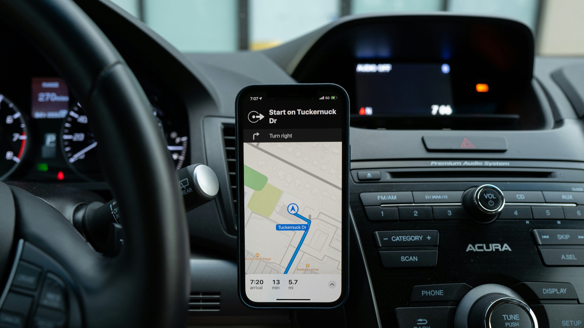 black android smartphone on car center console